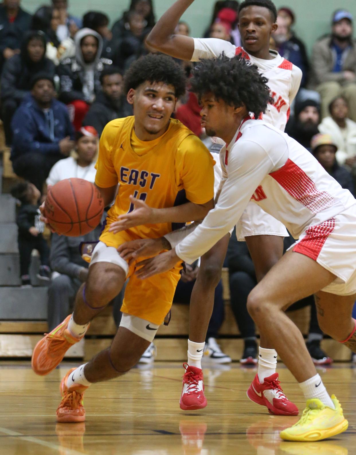 East's Markell Johnson drives the baseline on Franklin's Kollin McCullough.