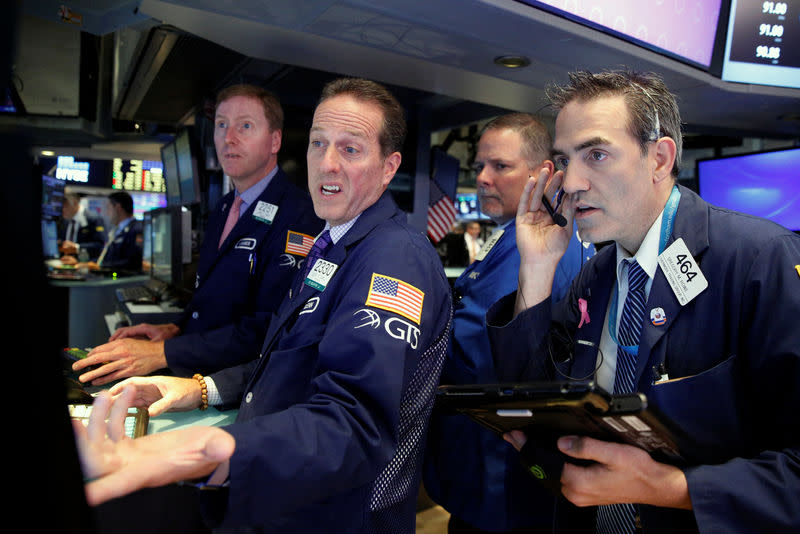 Traders work on the floor of the New York Stock Exchange (NYSE) in New York City, U.S., August 17, 2016. REUTERS/Brendan McDermid