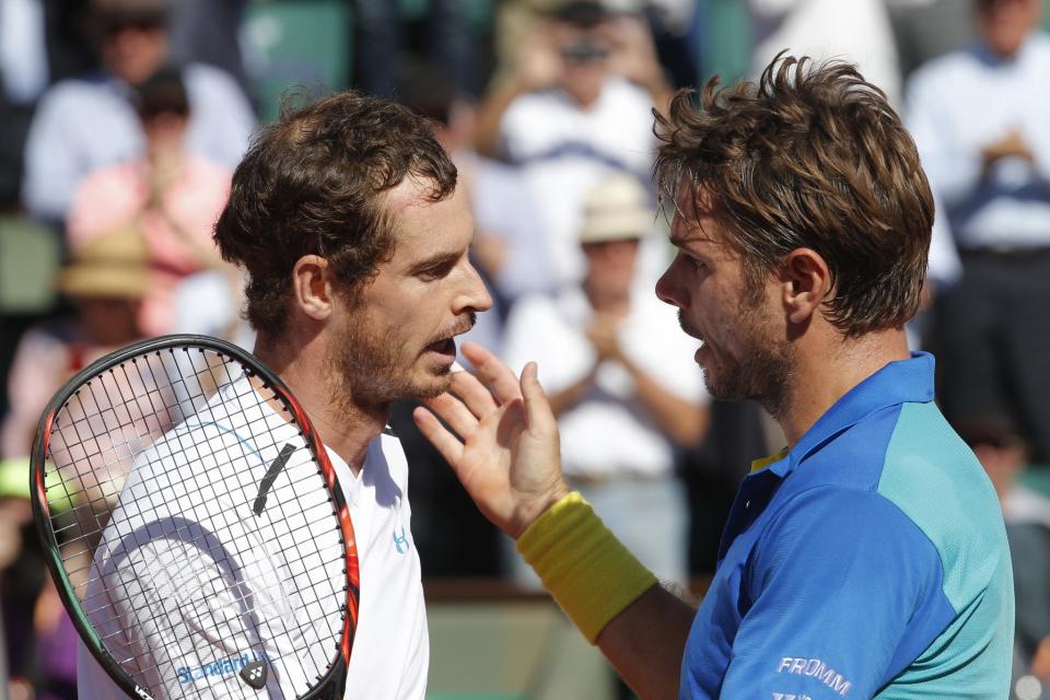 Switzerland's Stan Wawrinka, right, talks to Britain's Andy Murray after their semifinal match of the French Open