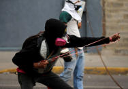 Opposition supporters clash with security forces during a rally against Venezuela's President Nicolas Maduro in Caracas, Venezuela, April 26, 2017. REUTERS/Carlos Garcia Rawlins