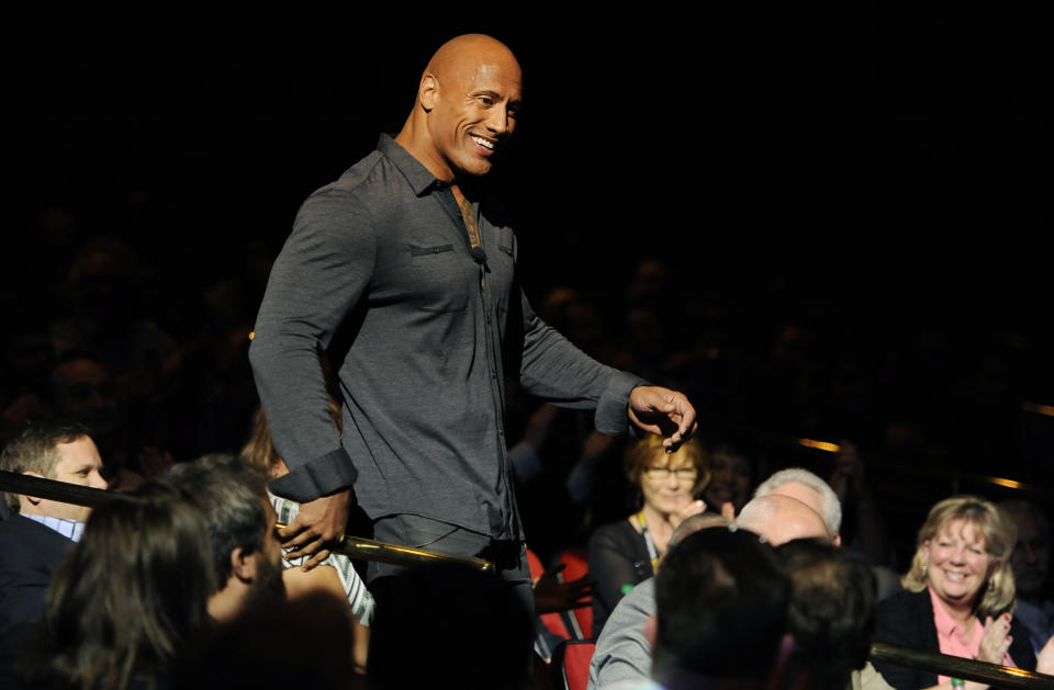 Dwayne Johnson, star of the upcoming film "Hercules," is introduced in the audience during the Opening Night Presentation from Paramount Pictures at CinemaCon 2014 on Monday, March 24, 2014, in Las Vegas. (Photo by Chris Pizzello/Invision/AP)