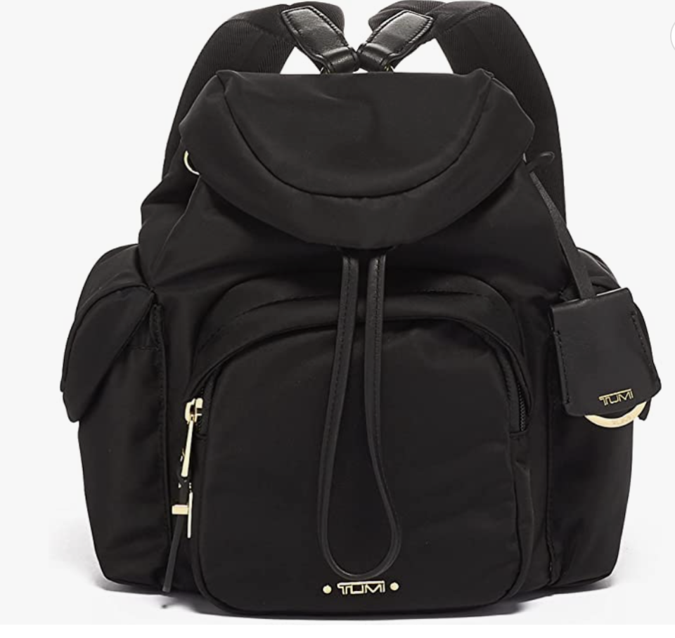 The black Tumi Voyageur Discon Sofia Backpack comes with multiple zippers and compartments.