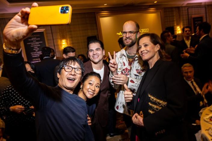 Los Angeles, CA - January 13: Ke Huy Quan takes a picture with his phone of his filmmates Stephanie Hsu, producer Jonathan Wang and Daniel Scheinart, from &quot;Everything Everwhere All At Once,&quot; with legend and &quot;Avatar&quot; actress Sigourney Weaver, at the AFI Awards at Four Seasons hotel, in Los Angeles, CA, Friday, Jan. 13, 2023. The entertainment industry's biggest names mingle, on the awards season's road toward the Oscars. (Jay L. Clendenin / Los Angeles Times)