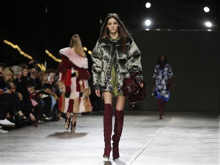 A model presents a creation from Topshop Unique Autumn/Winter 2014 collection during London Fashion Week February 16, 2014. REUTERS/Olivia Harris