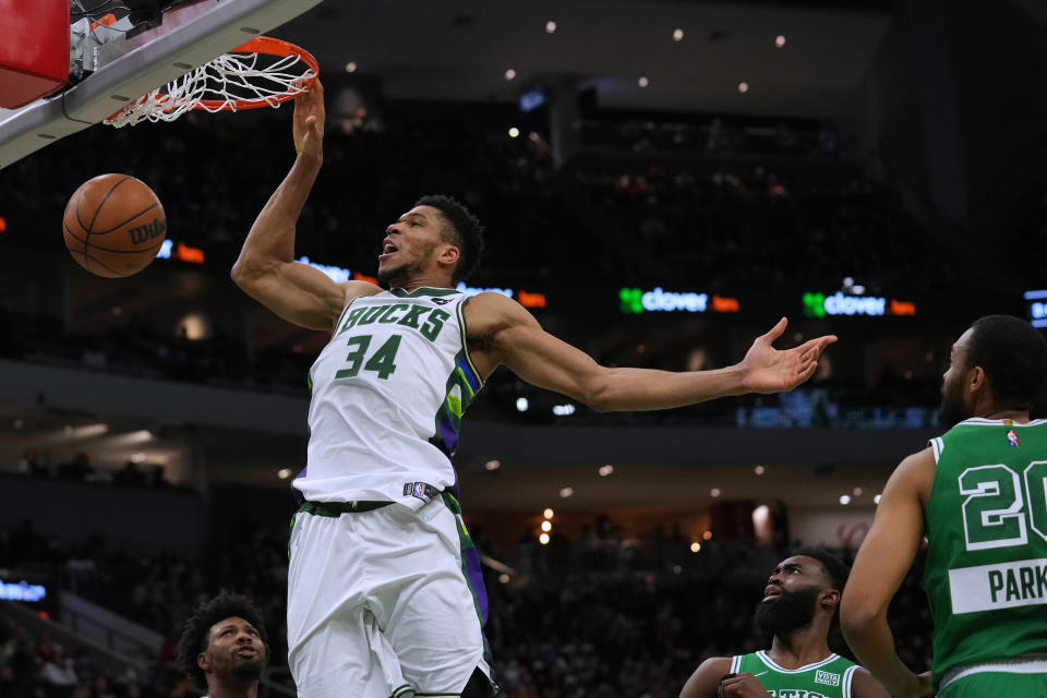 MILWAUKEE, WISCONSIN - DECEMBER 25: Giannis Antetokounmpo #34 of the Milwaukee Bucks makes a basket against the Boston Celtics in the second half at Fiserv Forum on December 25, 2021 in Milwaukee, Wisconsin. NOTE TO USER: User expressly acknowledges and agrees that, by downloading and or using this photograph, user is consenting to the terms and conditions of the Getty Images License Agreement. (Photo by Patrick McDermott/Getty Images)