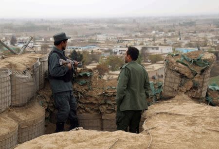 Afghan police officers keep watch at their forward base on the outskirts of Kunduz province, Afghanistan November 26, 2017. REUTERS/Nasir Wakif