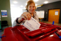 A woman casts her vote during European Parliament election in Riga, Latvia, May 25, 2019. REUTERS/Ints Kalnins