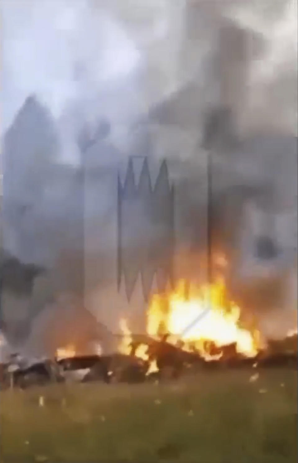 This image taken from video released by Ostorozhno Novosti on Wednesday, Aug. 23, 2023, shows the crash site of a private jet near the village of Kuzhenkino, Tver Region. Officials say a private jet has crashed over Russia, killing all 10 people on board. Mercenary chief Yevgeny Prigozhin was on the passenger list, but it wasn't immediately clear if he was on board. (Ostorozhno Novosti via AP)