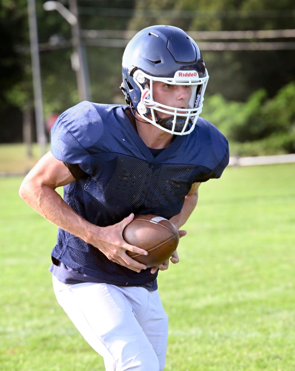 Jedidiah Zimmerman goes through a drill during Monomoy high football practice.