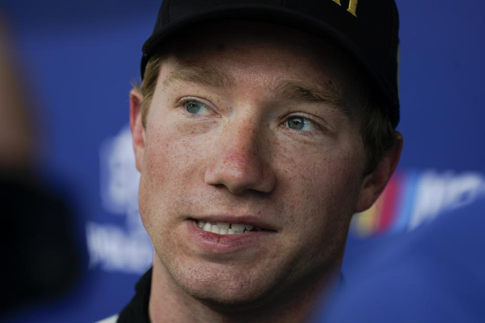 Tyler Reddick responds to a question during a news conference following qualifications for the NASCAR Cup Series auto race at Indianapolis Motor Speedway, Saturday, July 30, 2022, in Indianapolis. (AP Photo/Darron Cummings)