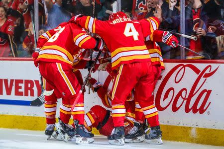 Jan 18, 2019; Calgary, Alberta, CAN; Calgary Flames center Sam Bennett (93) celebrates his goal with teammates against the Detroit Red Wings during the third period at Scotiabank Saddledome. Calgary Flames won 6-4. Mandatory Credit: Sergei Belski-USA TODAY Sports