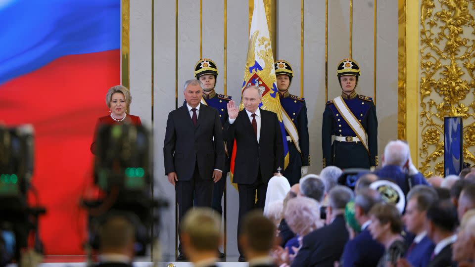 Putin waves during his inauguration ceremony. - Maxim Shemetov/Reuters