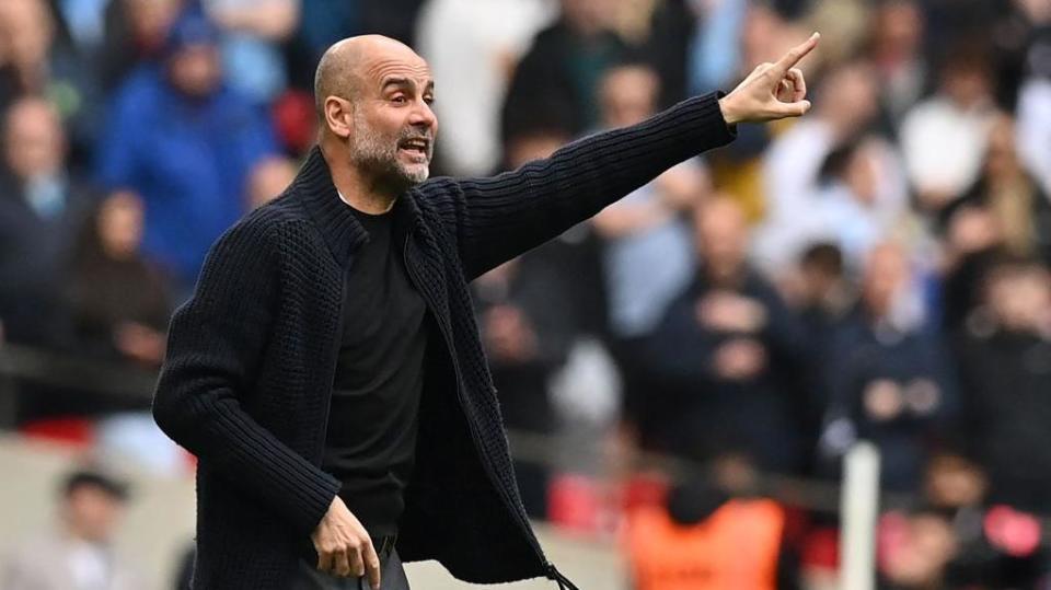 Pep Guardiola gives instructions on the sideline