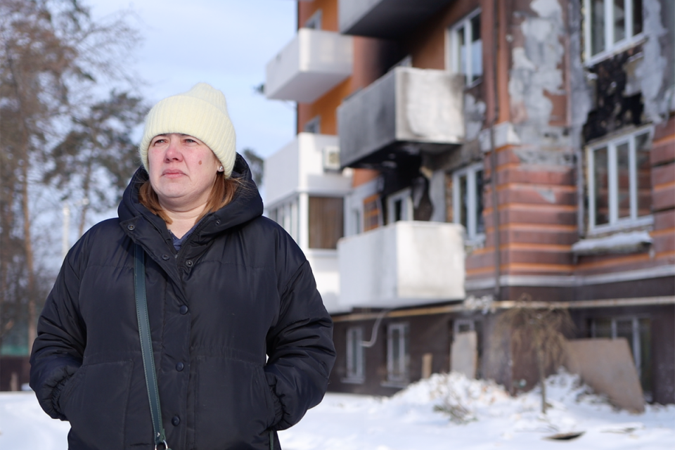 Olena outside her damaged apartment building in Irpin (Supplied)