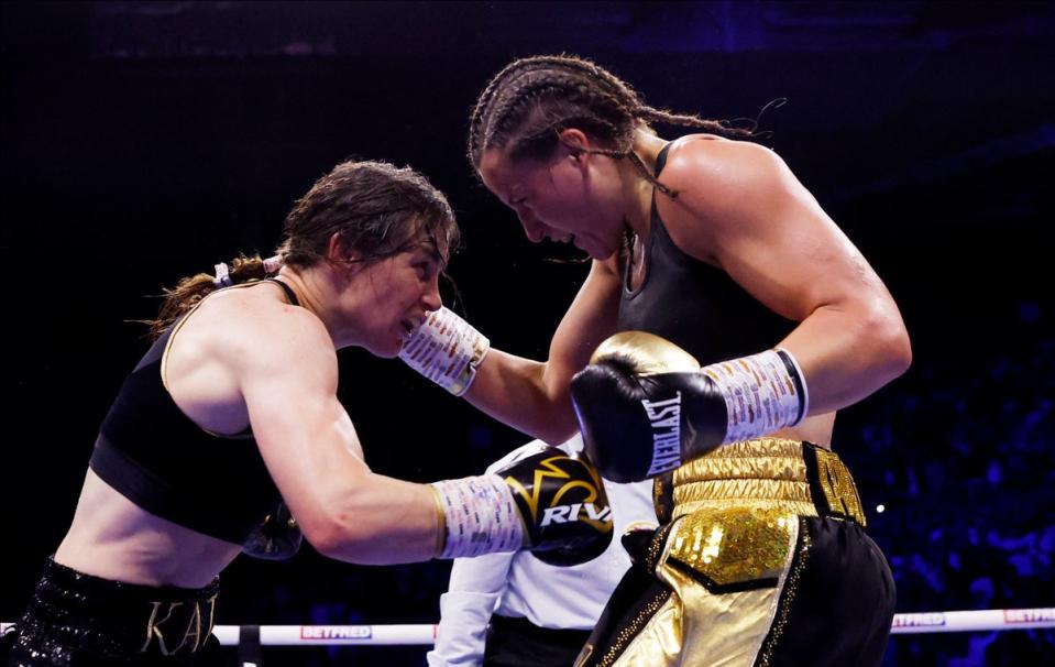 Taylor (left) and Cameron go toe to toe in their first fight (Action Images/Reuters)