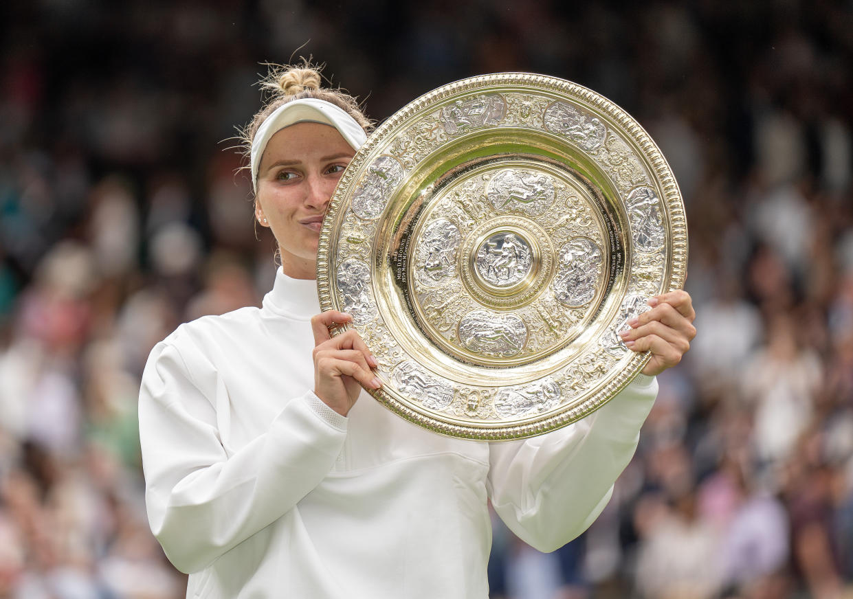 Marketa Vondrousova poses with the trophy after winning the women’s final against Ons Jabeur at the All England Club (Reuters via Beat Media Group subscription)