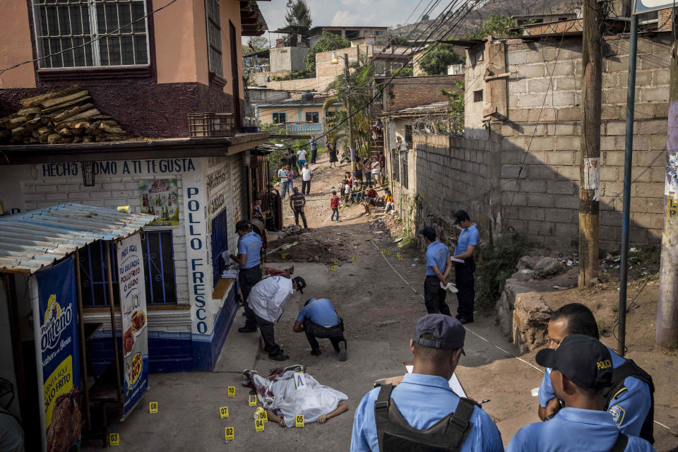<p>The crime scene of the murder of two brothers, Carlos Amador 22, and Edwin Amador, 20, shot in cold blood during broad daylight in the streets of the Suyapa neighbourhood in Teguciaglpa, the capital of Honduras. (Photo: Francesca Volpi) </p>
