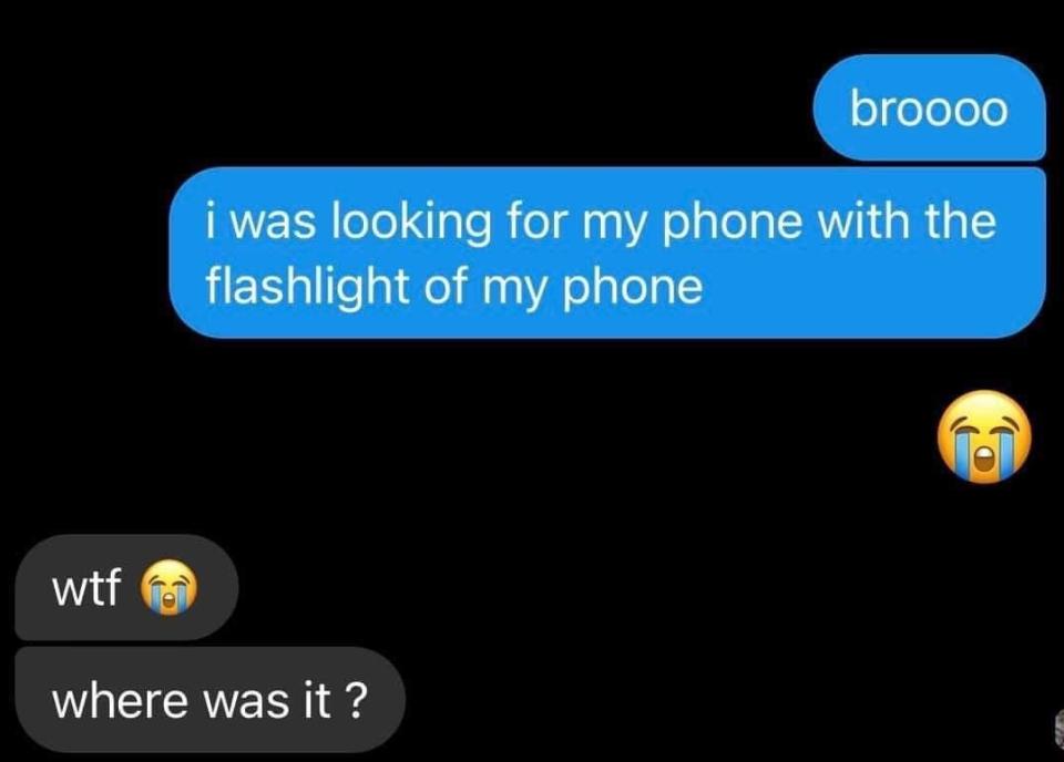 person looking for theeir phone with their phone's flashlight