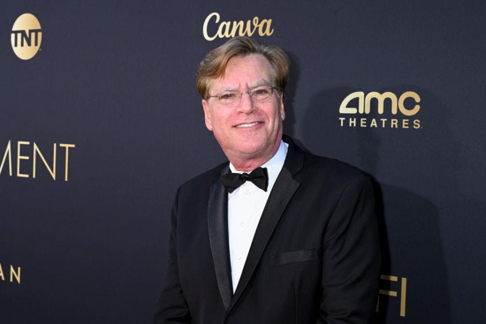 Aaron Sorkin smiling on the red carpet