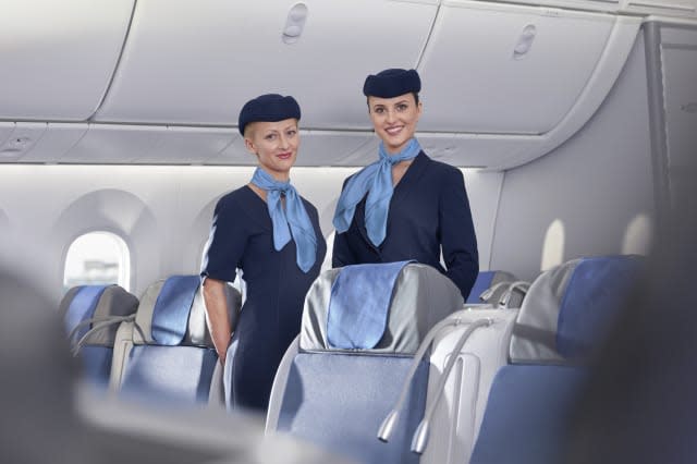 Portrait smiling, confident female flight attendants on airplane