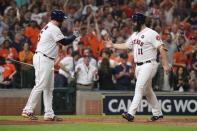 Oct 21, 2017; Houston, TX, USA; Houston Astros catcher Evan Gattis (11) celebrates with Houston Astros catcher Brian McCann (16) after hitting a home run against the New York Yankees during game seven of the 2017 ALCS playoff baseball series in the fourth inning at Minute Maid Park. Thomas B. Shea-USA TODAY Sports