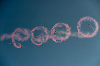 China's People Liberation Army (PLA) parachutists perform during the 9th China International Aviation and Aerospace Exhibition in Zhuhai on November 13, 2012. China's air show comes as the Communist Party holds a meeting to select the country's new leaders -- including the party's Central Military Commission, which controls the armed forces. AFP PHOTO / Philippe Lopez