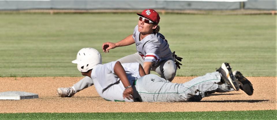 Christoval second baseman Jake Boness tags out Hamlin's Isaiah Garza, who was trying to steal second base after getting a leadoff hit in the second inning.