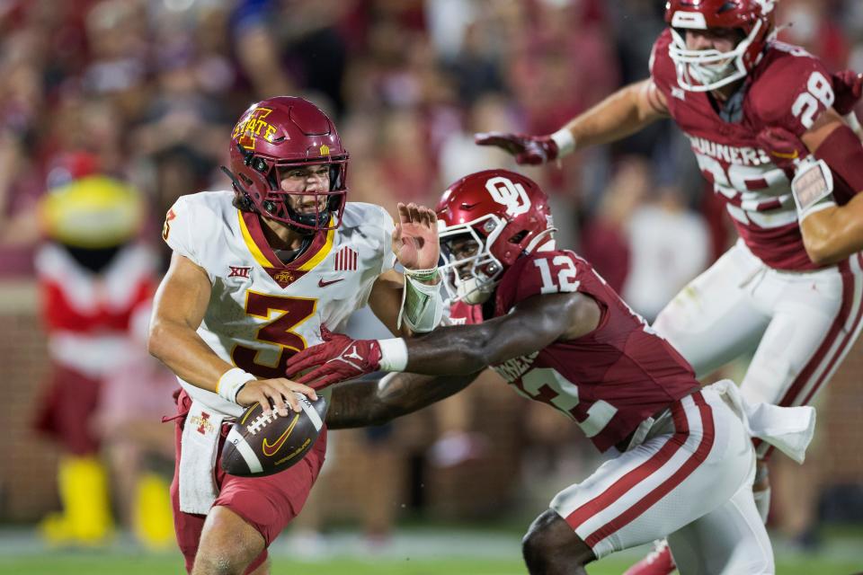 Iowa State's Rocco Becht is pressured by Oklahoma's defense during Saturday's 50-20 loss at Oklahoma.