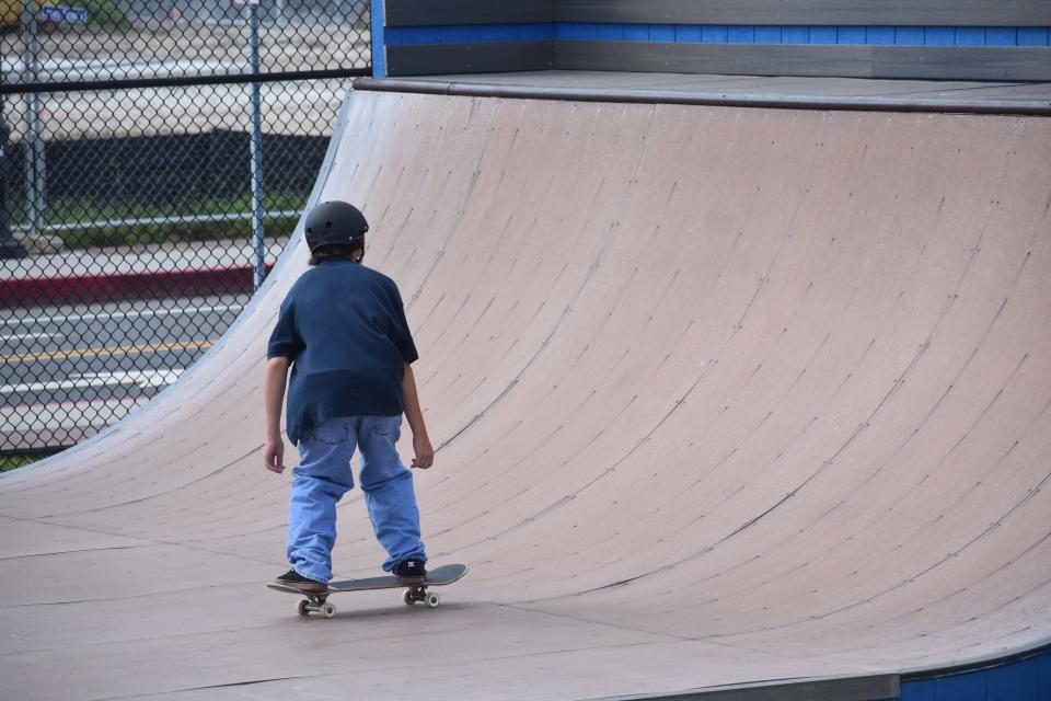 Jeremy Spear shows off his skateboarding skills inside the empty Ocean Bowl Skate Park in Ocean City, Maryland, on August 9, 2023.