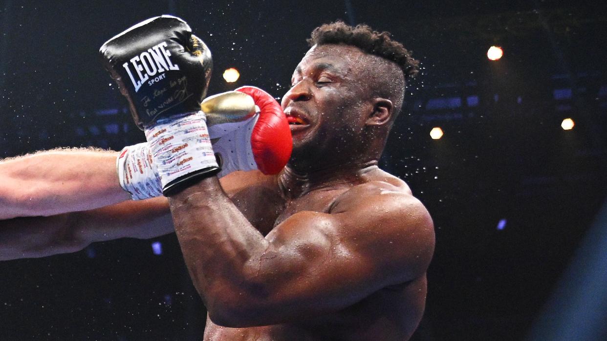  Francis Ngannou takes a punch in the ring ahead of the start of the Joshua vs Ngannou live stream in Riyadh, Saudi Arabia. 