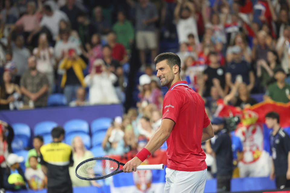 Novak Djokovic of Serbia celebrates his win over Zhizhen Zhang of China during the United Cup tennis tournament in Perth, Australia, Sunday, Dec. 31, 2023. (AP Photo/Trevor Collens)