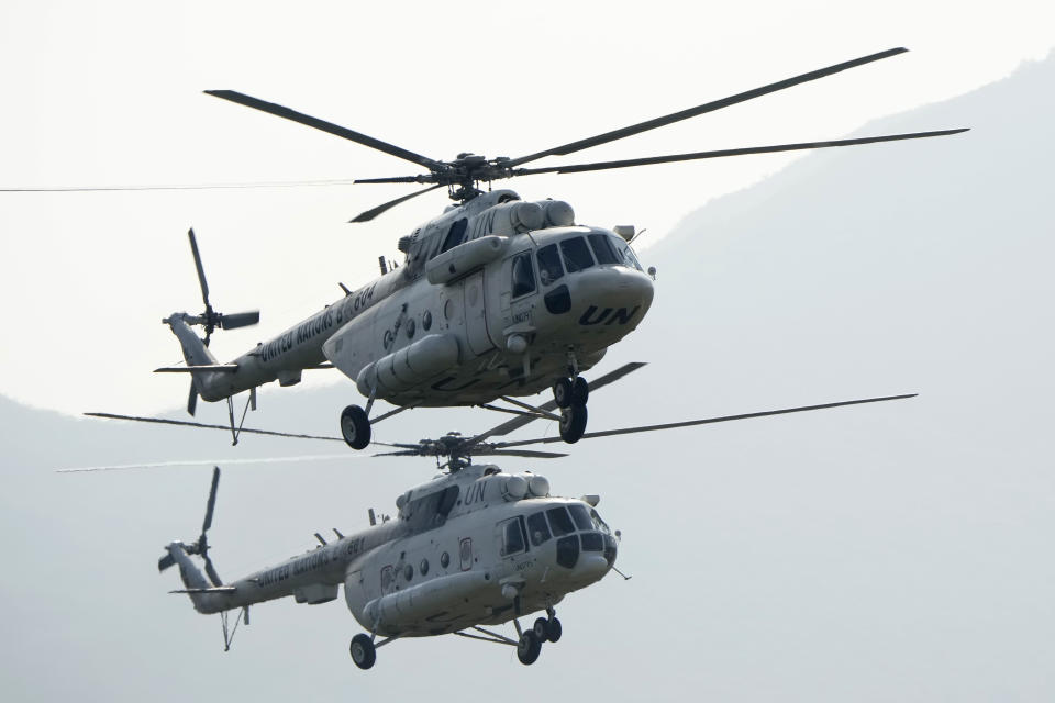 United Nations helicopters take art in the Shared Destiny 2021 drill at the Queshan Peacekeeping Operation training base in Queshan County in central China's Henan province Wednesday, Sept. 15, 2021. Peacekeeping troops from China, Thailand, Mongolia and Pakistan took part in the 10 days long exercise that field reconnaissance, armed escort, response to terrorist attacks, medical evacuation and epidemic control. (AP Photo/Ng Han Guan)