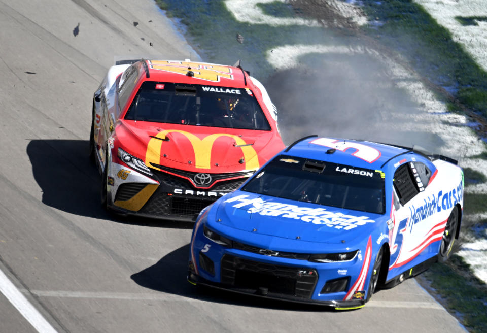 LAS VEGAS, NV - OCTOBER 16: Bubba Wallace (#45 23XI Racing MoneyLion Toyota), rear, and Kyle Larson (#5 Hendrick Motorsports HendrickCars.com Chevrolet), front, crash on the front straight away during the NASCAR Cup Series Playoff South Point 400 Sunday October 16, 2022 at Las Vegas Motor Speedway in Las Vegas, Nevada. (Photo by Will Lester/Icon Sportswire via Getty Images)