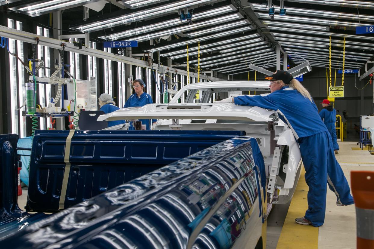 Workers do final inspection at the Paint Shop at General Motors Flint Assembly in Flint on Tuesday, February 5, 2019.
