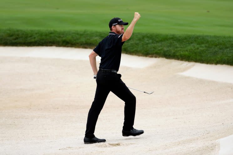 Jimmy Walker holes a bunker shot on No. 10 for birdie (Getty Images)