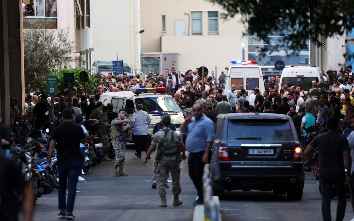 People gather outside a hospital in Beirut following the simultaneous detonation of thousands of pagers used by Hezbollah