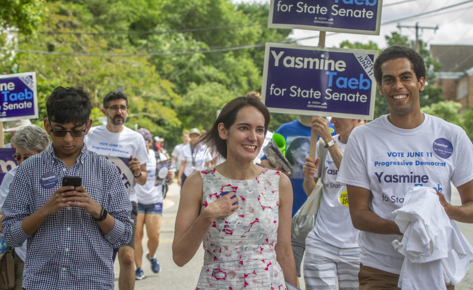 Yasmine Taeb, a human rights attorney challenging Dick Saslaw, talks to constituents in the Memorial Day Parade in Falls Church, Virginia, on May 27. (Photo: Cal Cary/The Washington Post via Getty Images)