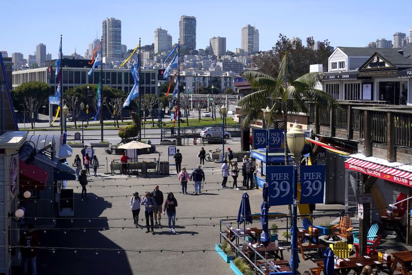 People visit Pier 39 in San Francisco, Wednesday, April 26, 2023. (AP Photo/Jeff Chiu)