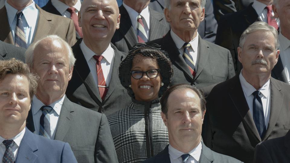 Regina King as Shirley Chisholm standing among other politicians in Shirley