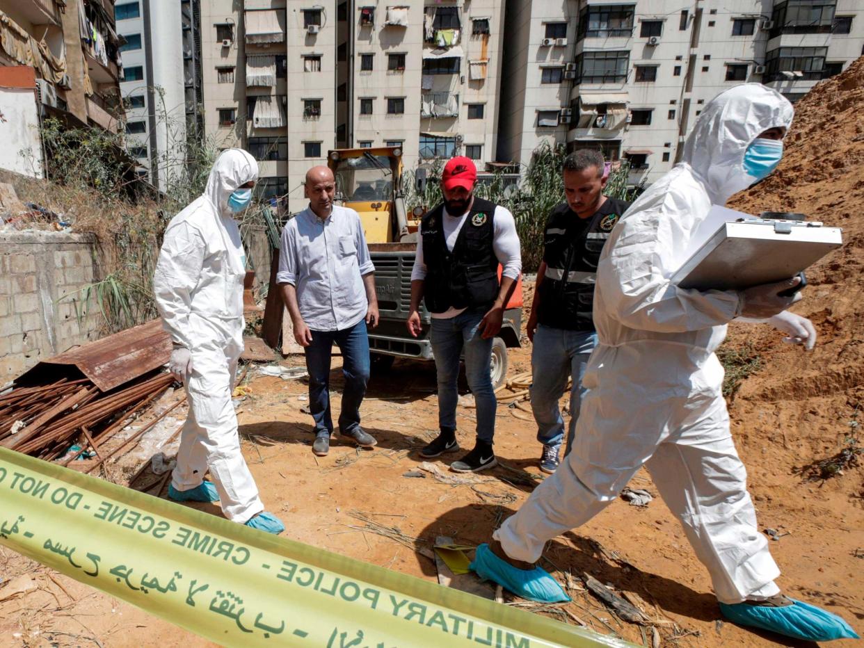 Forensic investigators of Lebanon's military intelligence inspecting the scene where two drones came down in the vicinity of a media centre of the Shiite Hezbollah movement on Saturday: AFP/Getty