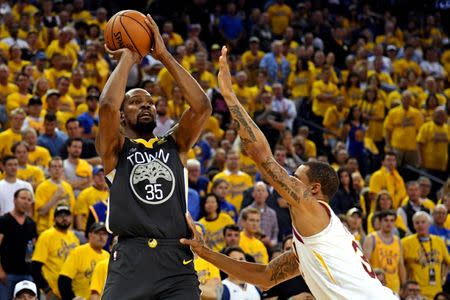 June 3, 2018; Oakland, CA, USA; Golden State Warriors forward Kevin Durant (35) shoots the ball against Cleveland Cavaliers forward Jeff Green (32) during the fourth quarter in game two of the 2018 NBA Finals at Oracle Arena. Kyle Terada-USA TODAY Sports