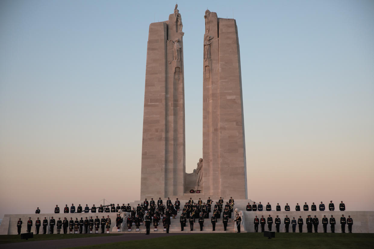 Members of the Canadian armed forces take part in a Sunset Ceremony at the Canadian National Vimy Memorial. Photo from Getty Images