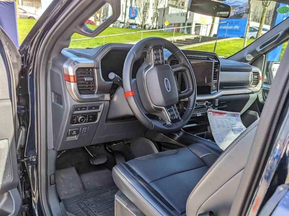 the black leather interior of a 2024 Ford F-150 Raptor