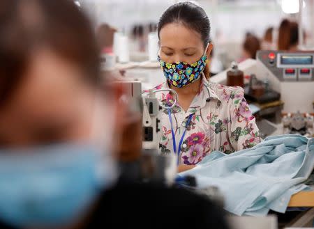 Labourers work at TAL garment factory in Vinh Phuc province, Vietnam May 23, 2017. Picture taken May 23, 2017. REUTERS/Kham