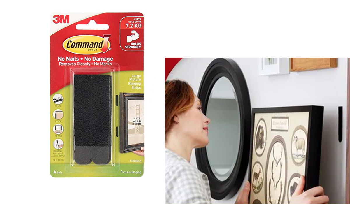 Command Strips in black, woman hanging frame using Command Strips