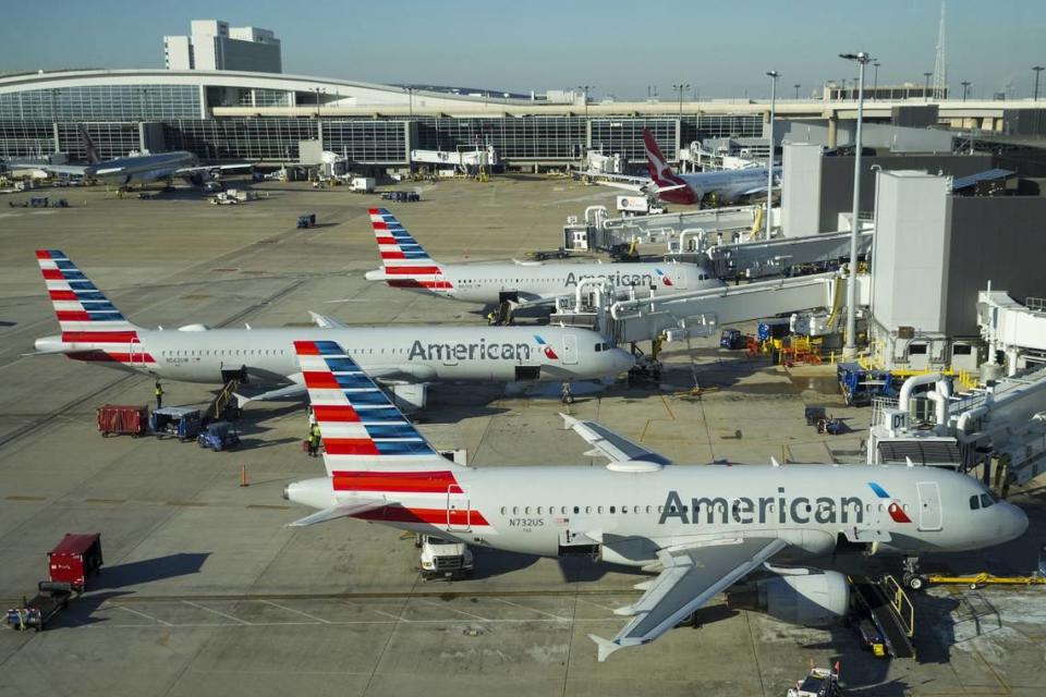 American Airlines planes are seen at the gates of Terminal D at Dallas/Fort Worth International Airport on Friday, Feb. 3, 2023.
