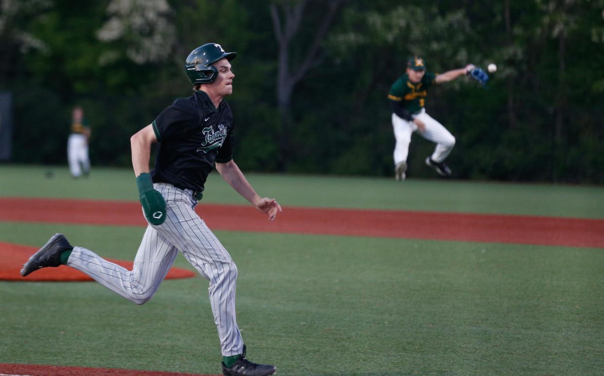 Trinity’s Kyle Campbell scores a run against St. X Wednesday evening. 
April 24, 2024