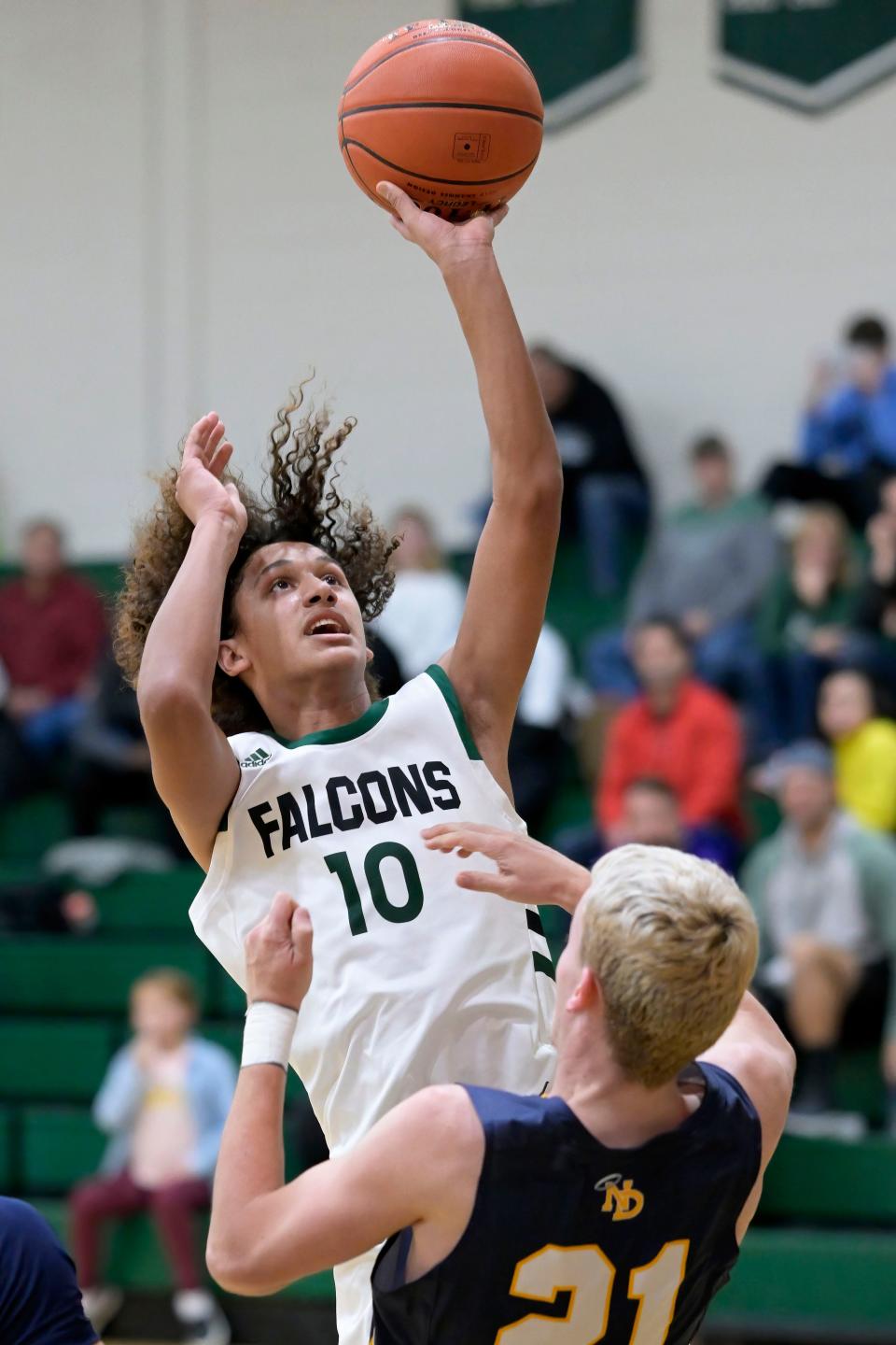 West Burlington freshman Ayden Figuereo puts up a shot against Notre Dame's Matthew Booten Tuesday at West Burlington.