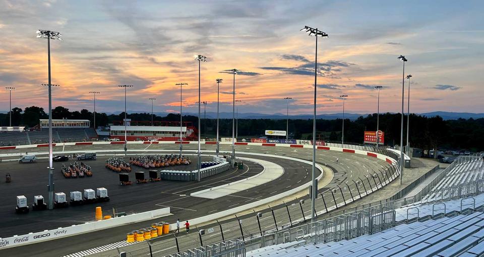 The sun sets behind Turn 4 at North Wilkesboro Speedway