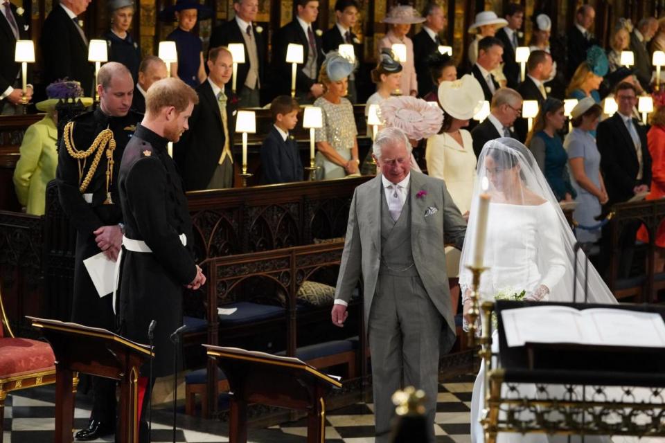 Prince Charles walking Meghan down the aisle (PA Wire/PA Images)